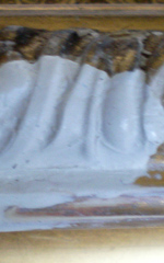 Using moulds to repair damaged sections of painting frames.